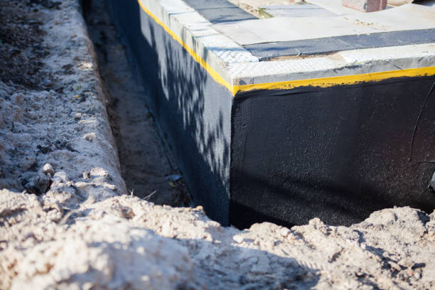 Professional Waterproofing technician working in Edgewater, MD